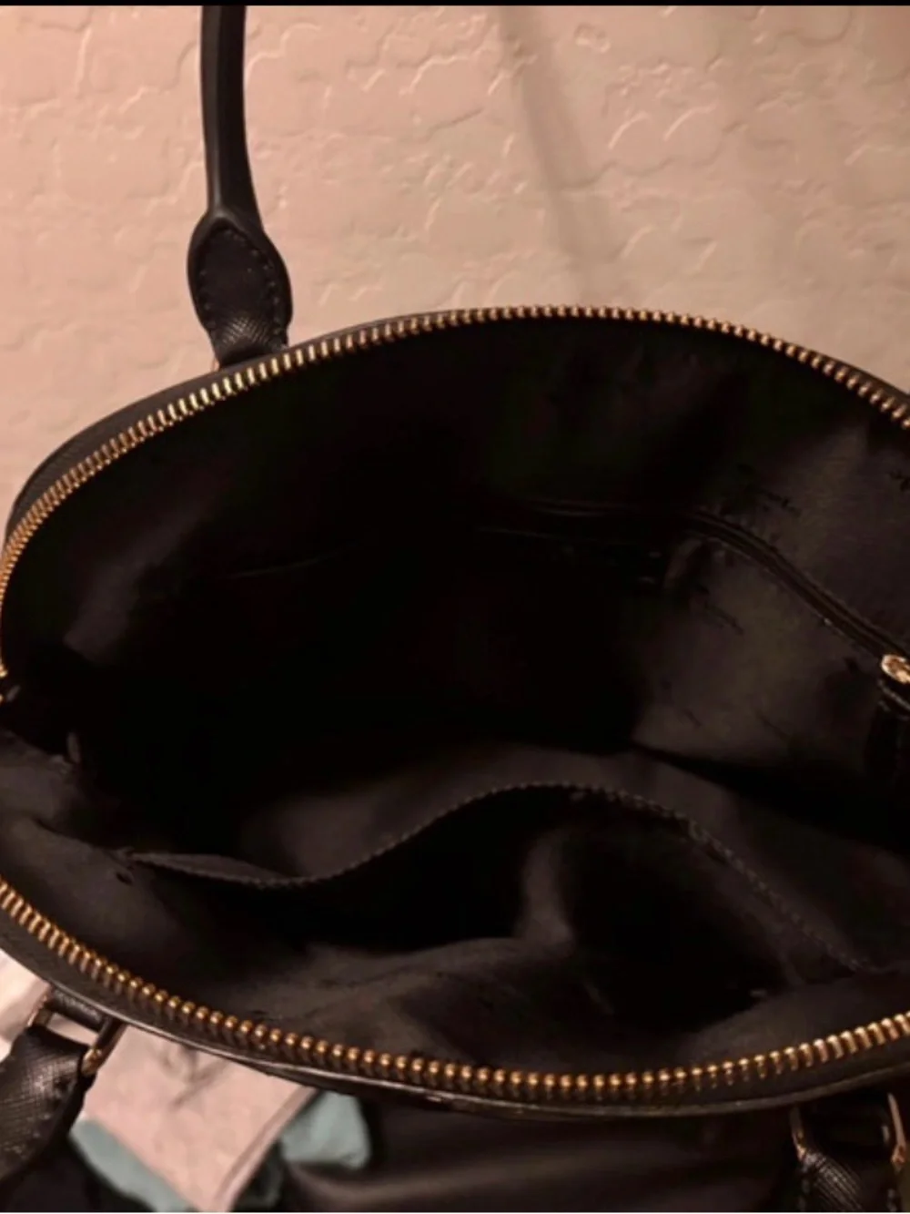 kate spade black dome-shaped satchel with gold logo